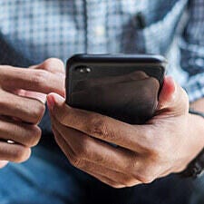 man holding a mobile phone