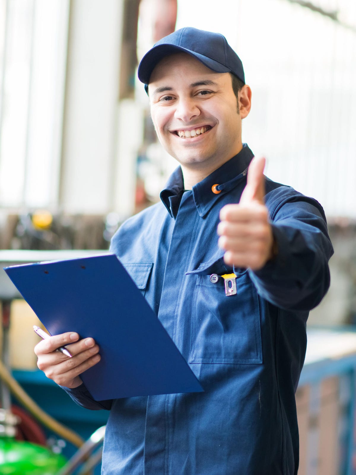 Smiling technician thumbs up