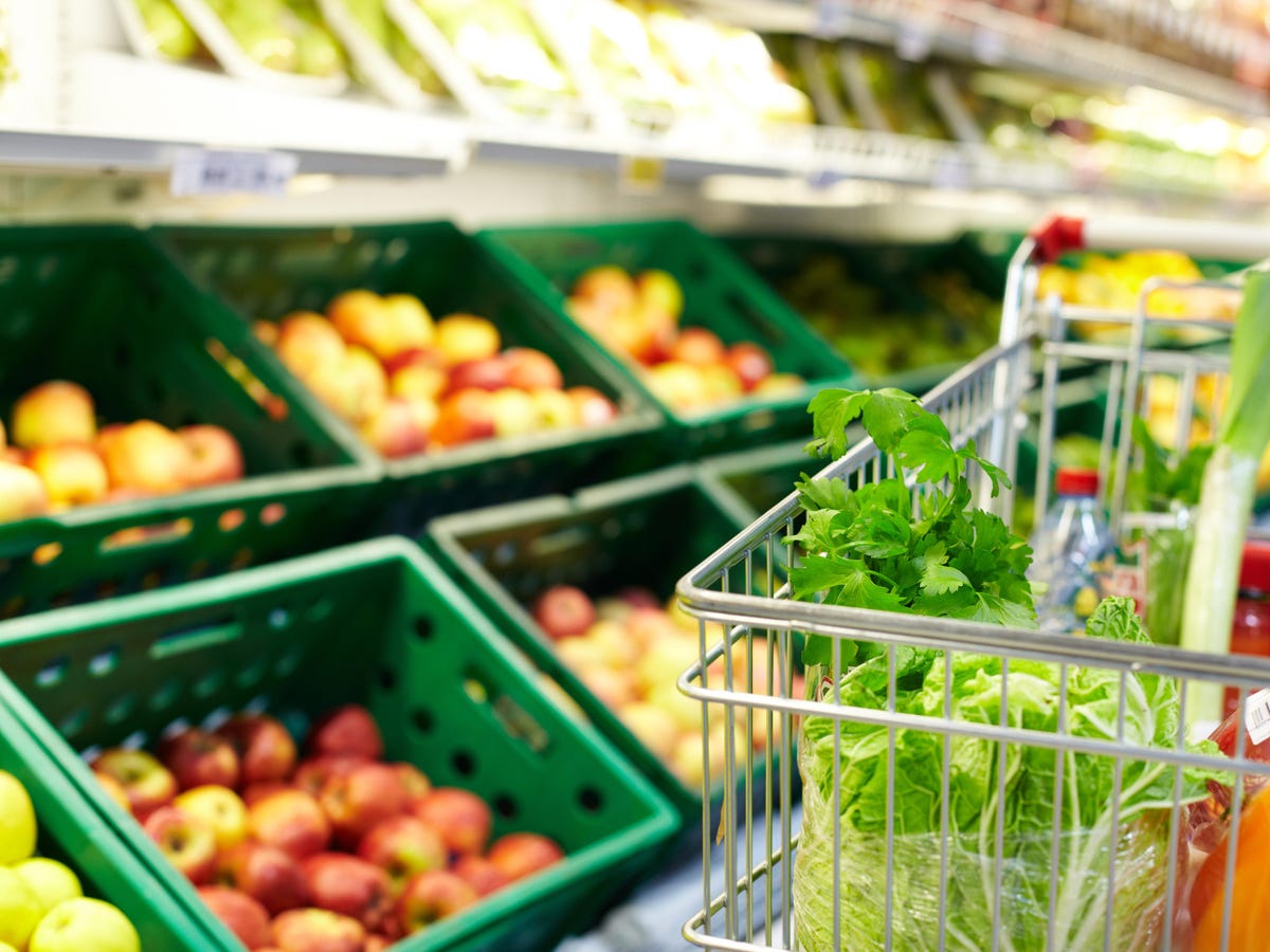 Image of fresh vegetables in cart in supermarket