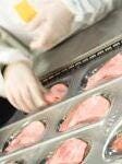 Meat product being packed