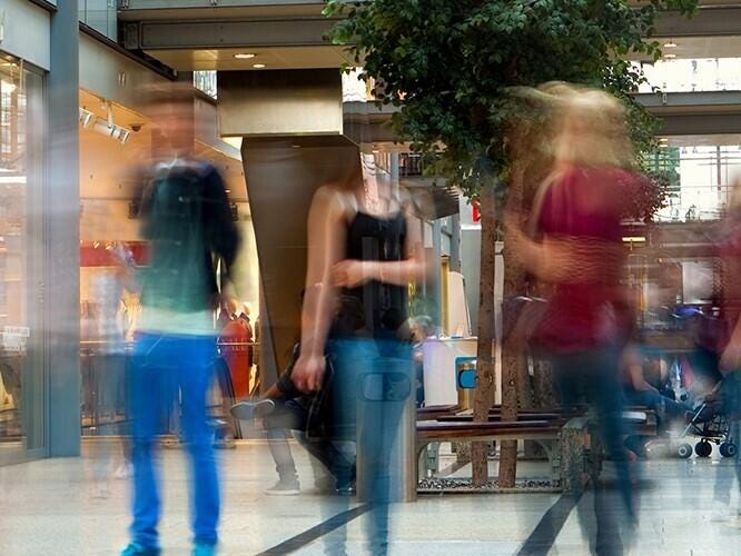 Shopping center with motion blur shoppers