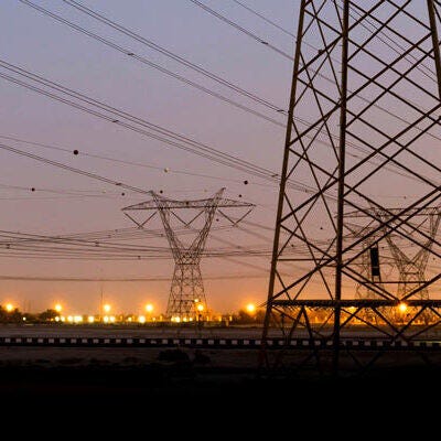 Electric transmission towers at dusk