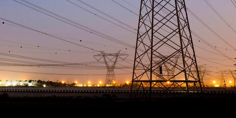 Electric transmission towers at dusk