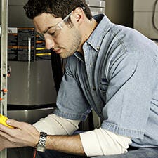 Engineer troubleshooting hvac system