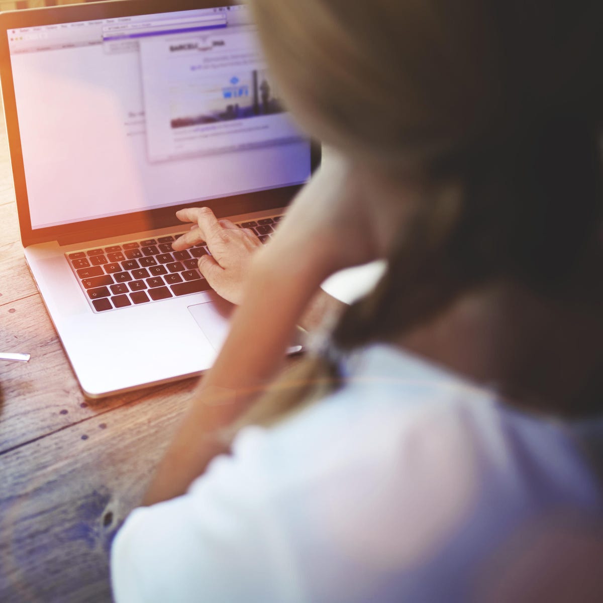 woman typing on a laptop