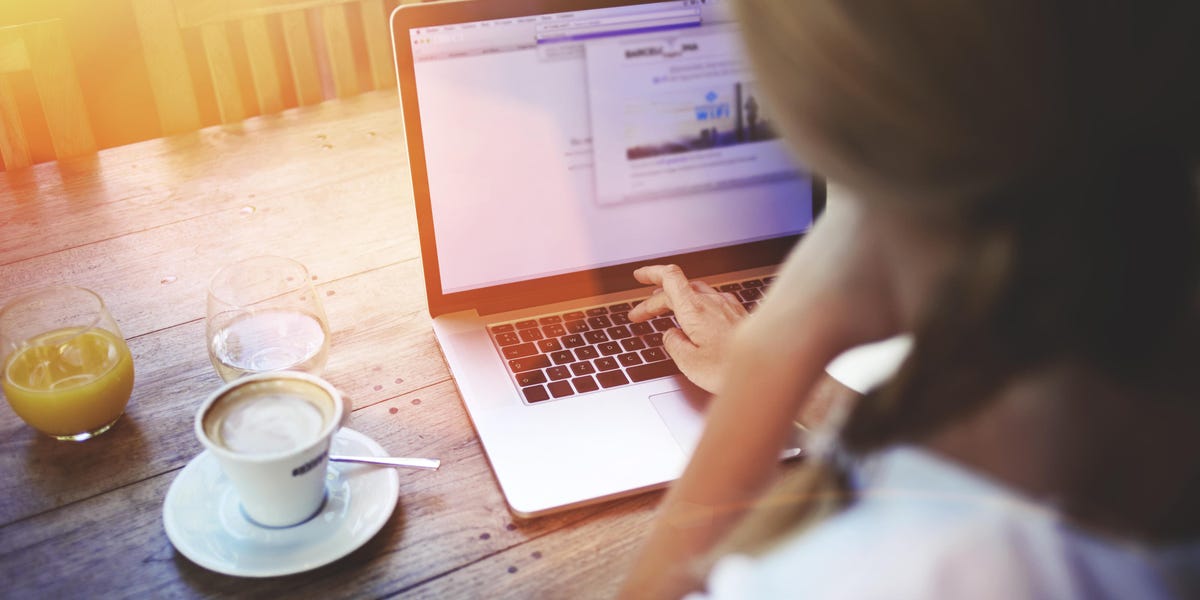 woman typing on a laptop