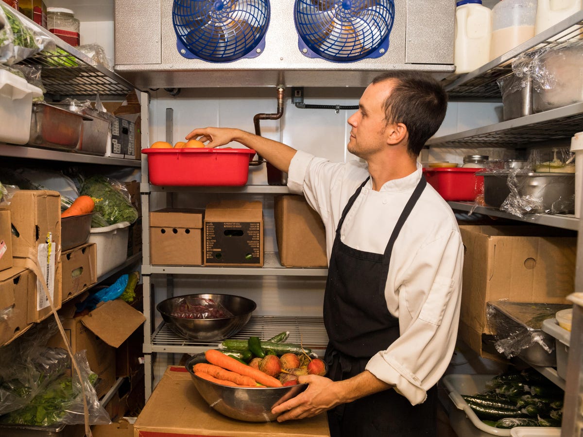 Chef inside the walk-in refrigerator