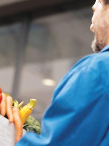 woman carrying vegetables