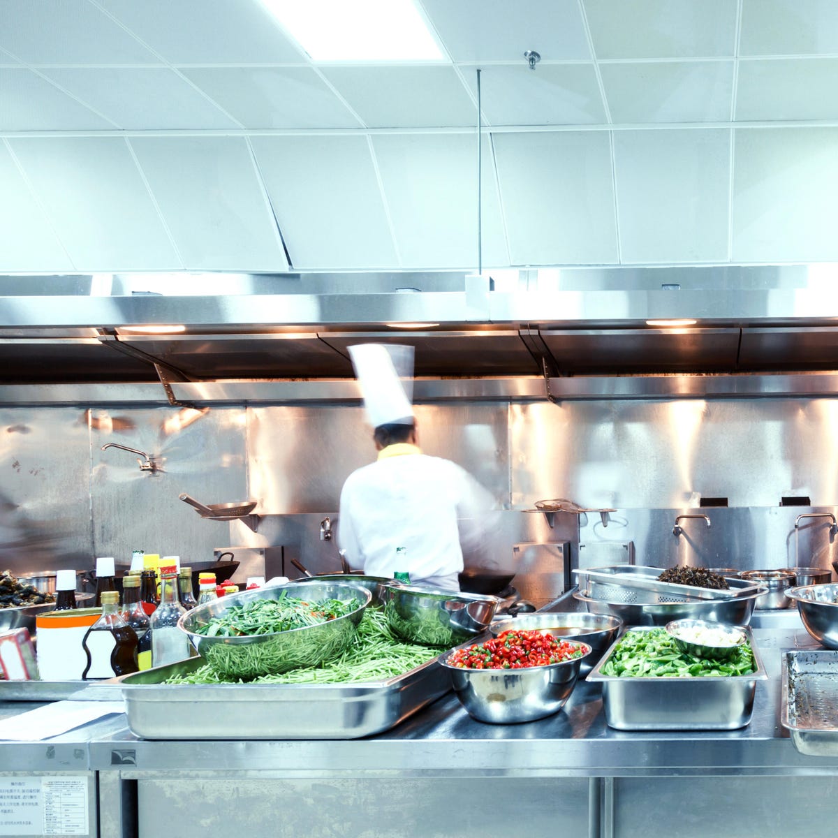 chef in action at the kitchen