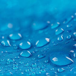 water droplets on blue surface