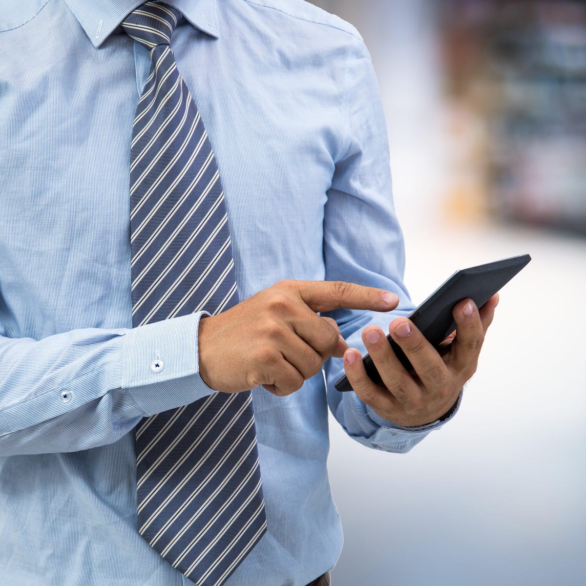 Man pointing on to his mobile phone