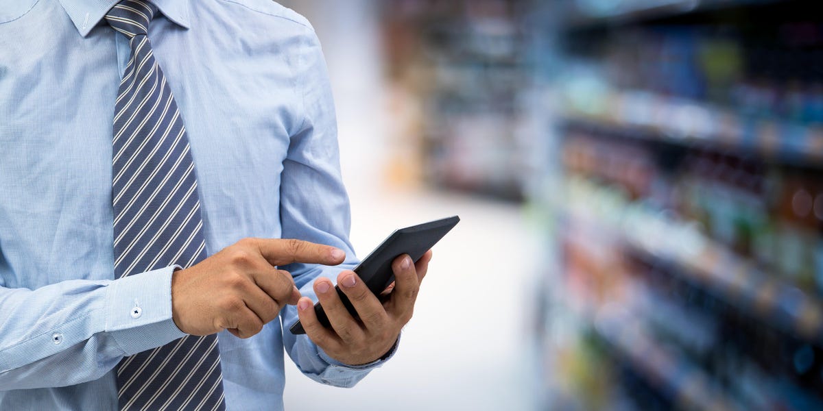 Man pointing on to his mobile phone