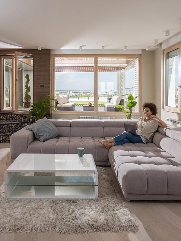 Woman lounging in a bright living room