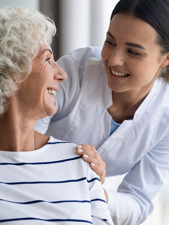 Patient and a nurse smiling