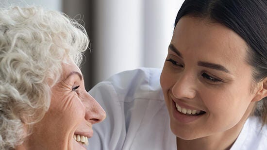 Patient and a nurse smiling