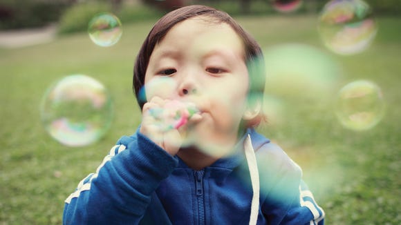 Clean China - Boy Blowing Bubbles