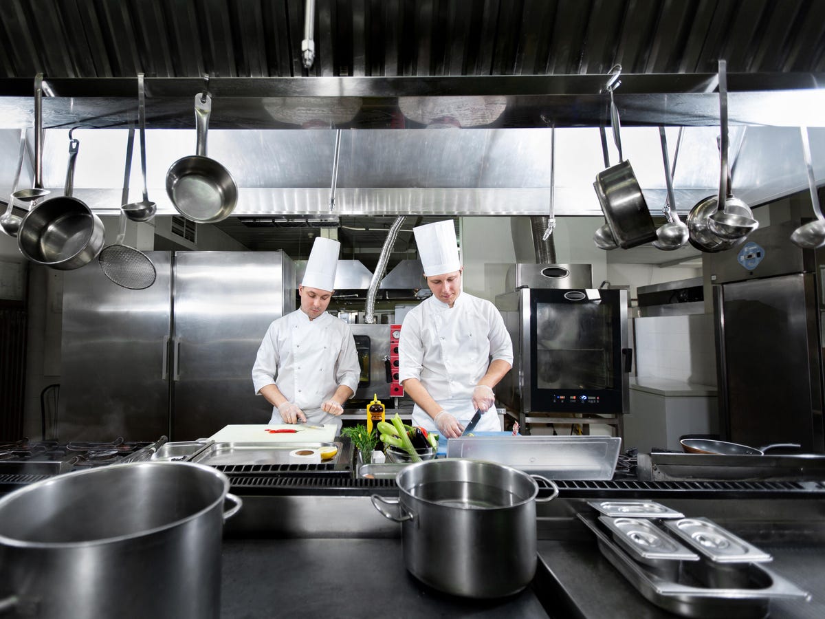 2 chefs in commercial kitchen