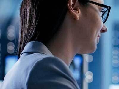 Close up of woman facing computer monitor