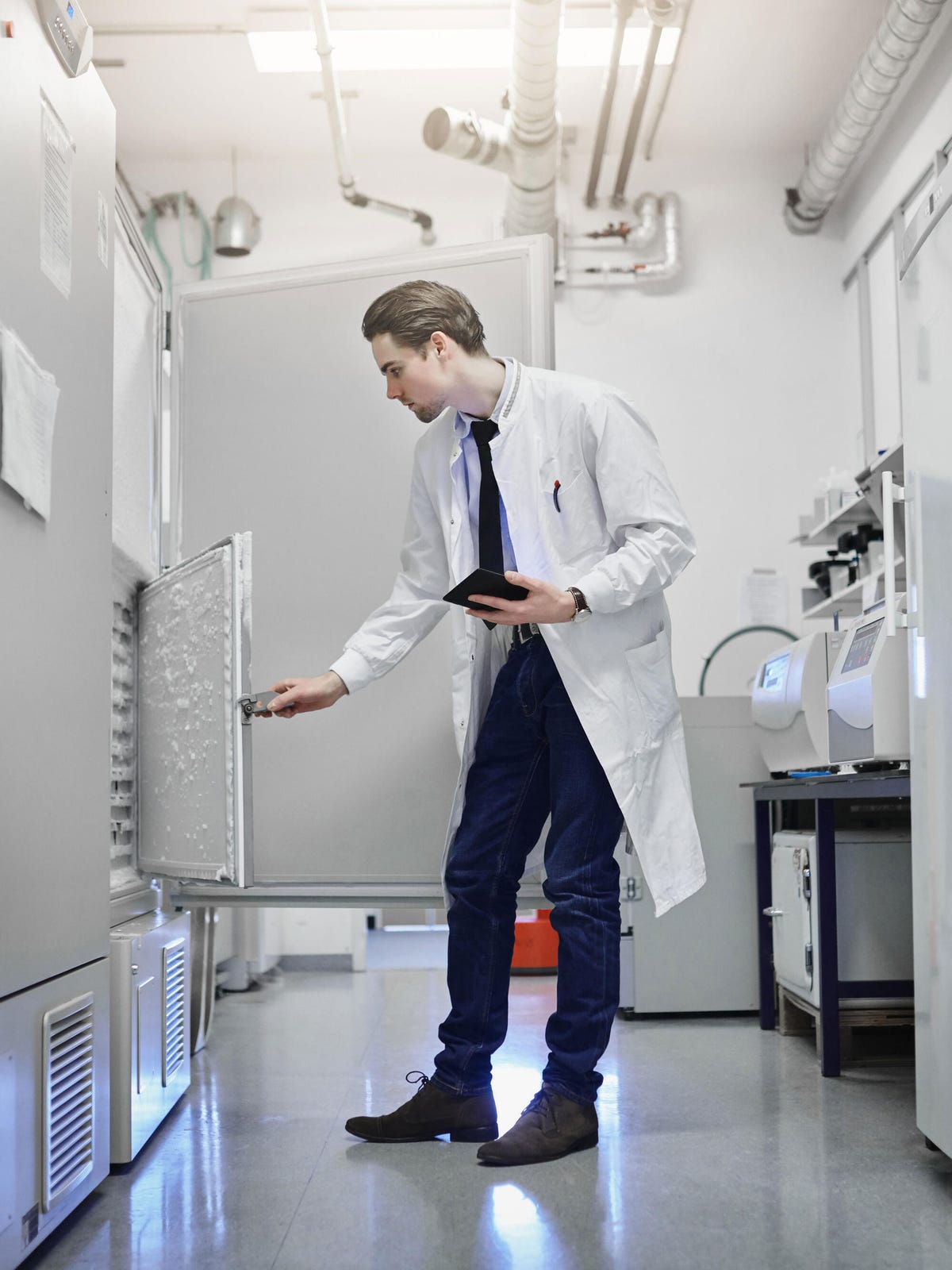 Doctor in lab holding a tablet