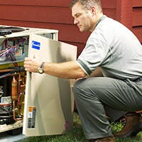 Copeland technical specialist checking outdoor condensing unit