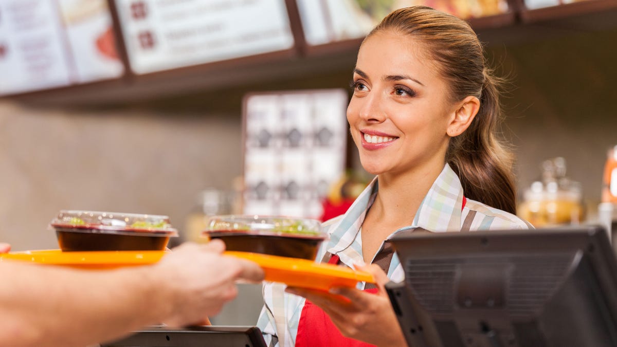 Worker serving two meals tray