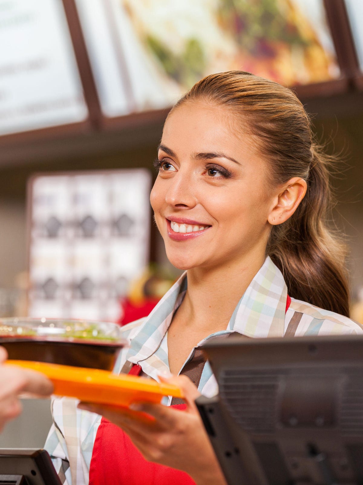 Worker serving two meals tray