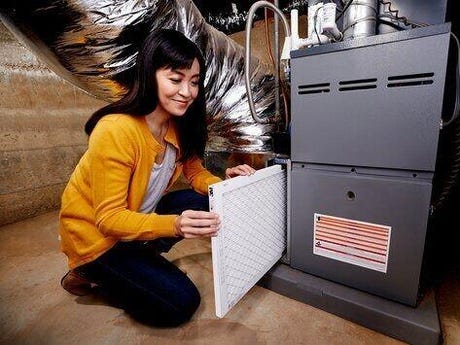 changing furnace filter changing furnace filter