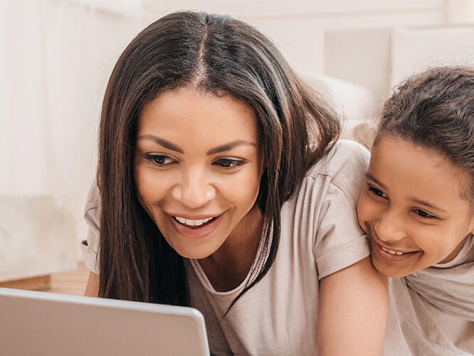 Happy mother and daughter in the living room