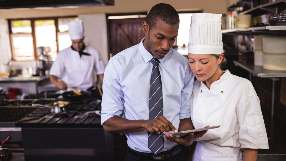 Manager and chef with tablet