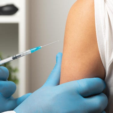 Injection and arm close up Injection and arm close up