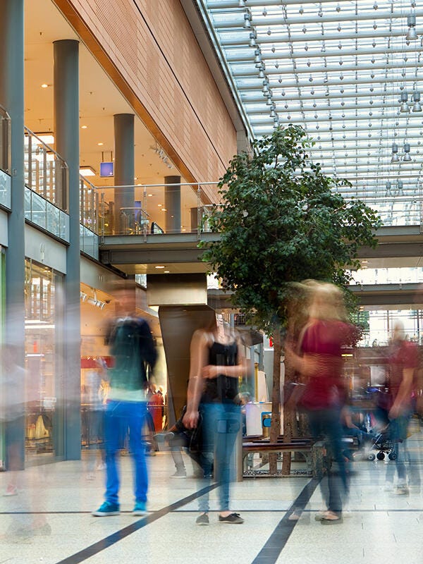 Commercial building interior with blurry people